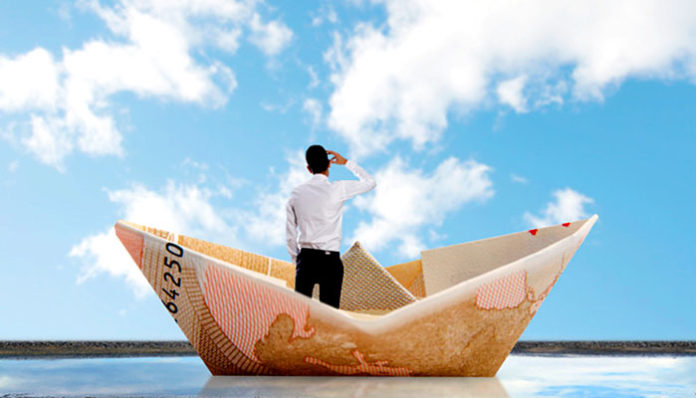 rear-view-of-businessman-in-a-paper-boat_1154-718