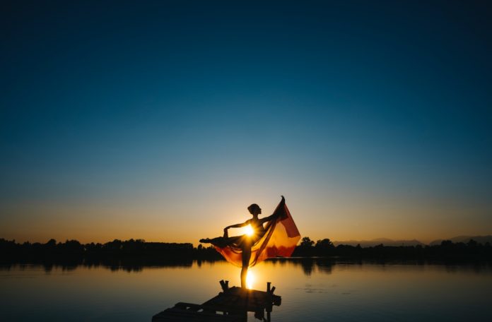 woman-standing-in-front-of-body-of-water-under-clear-blue-2702960