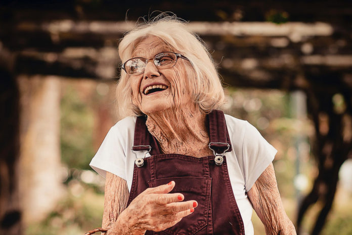 woman-wearing-brown-dungaree-pants-holding-sunhat-and-picnic-2050981