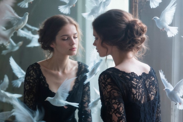 woman-black-dress-white-doves-mirrora