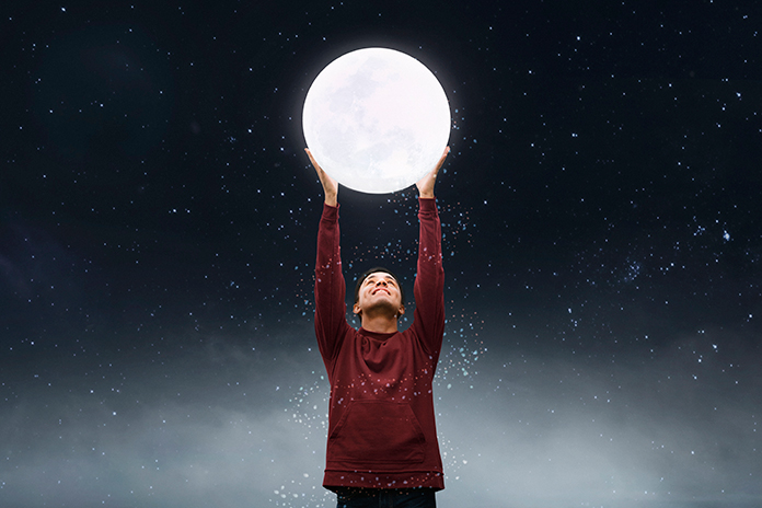 child-holding-moon