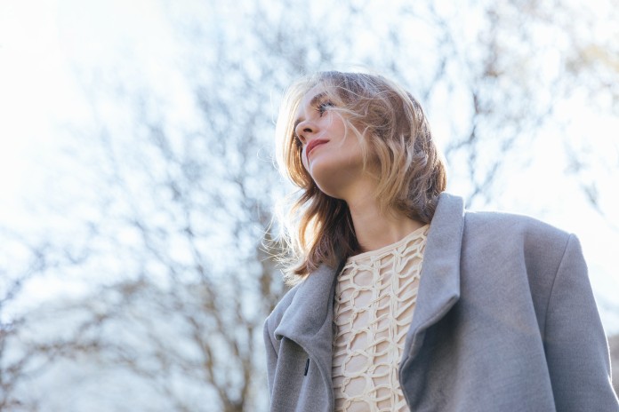 low-angle-view-woman-staring-afar